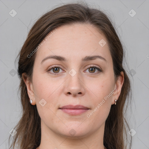 Joyful white young-adult female with long  brown hair and grey eyes