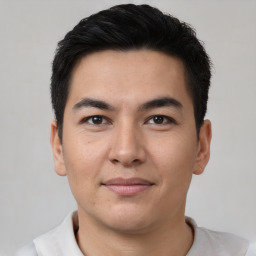 Joyful asian young-adult male with short  brown hair and brown eyes