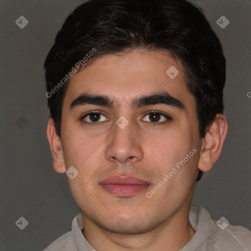 Joyful latino young-adult male with short  brown hair and brown eyes