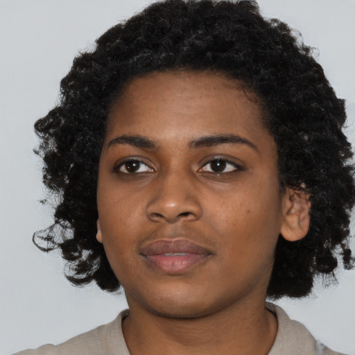 Neutral black young-adult female with short  black hair and brown eyes