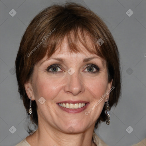 Joyful white adult female with medium  brown hair and grey eyes