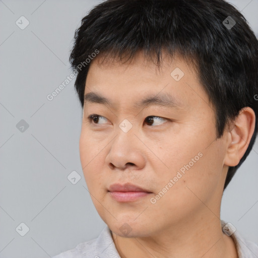 Neutral asian young-adult male with short  black hair and brown eyes