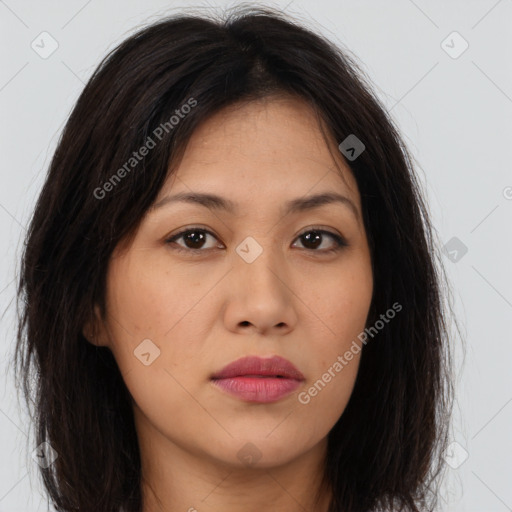 Joyful asian young-adult female with long  brown hair and brown eyes