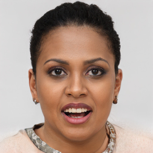 Joyful black young-adult female with short  brown hair and brown eyes