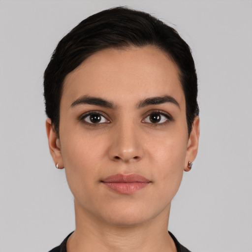 Joyful white young-adult female with short  black hair and brown eyes