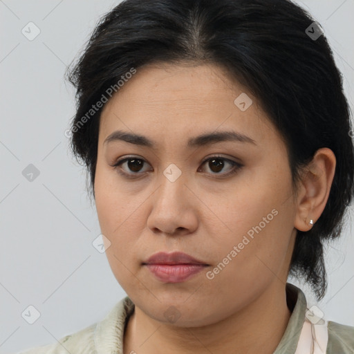 Joyful latino young-adult female with medium  brown hair and brown eyes