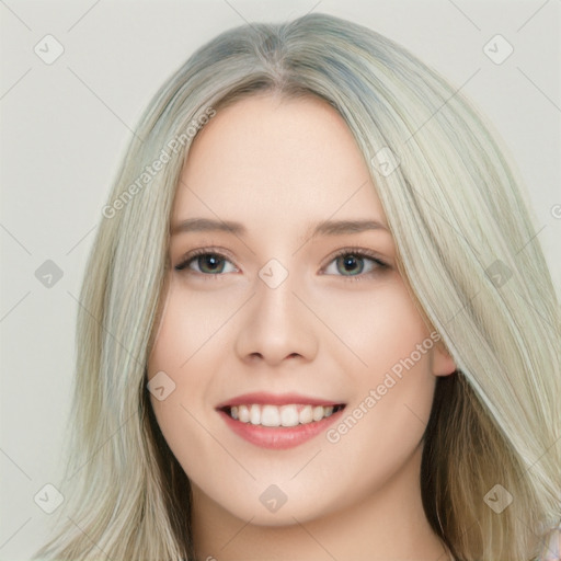 Joyful white young-adult female with long  brown hair and green eyes