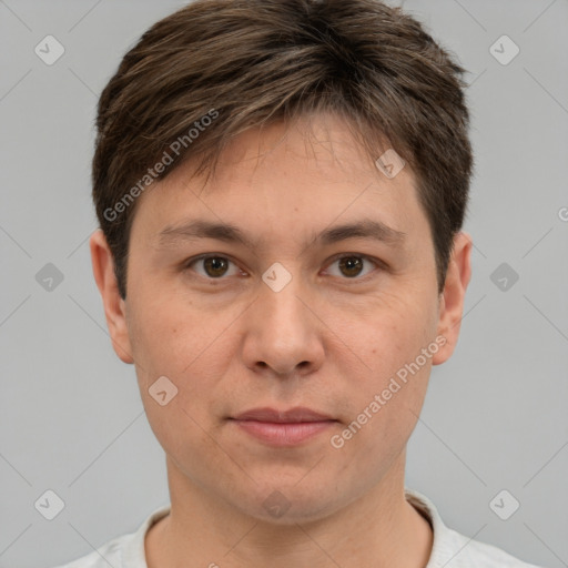 Joyful white adult male with short  brown hair and brown eyes