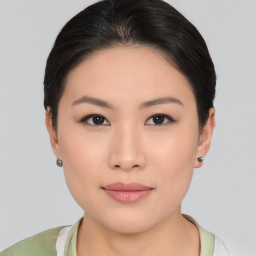 Neutral asian young-adult female with medium  brown hair and brown eyes