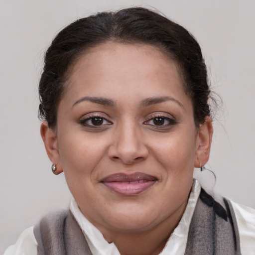 Joyful latino young-adult female with medium  brown hair and brown eyes