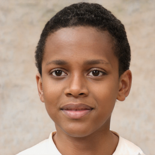 Joyful black child male with short  brown hair and brown eyes
