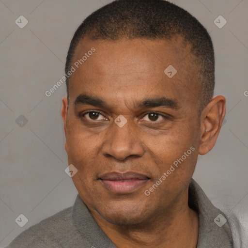 Joyful black adult male with short  brown hair and brown eyes