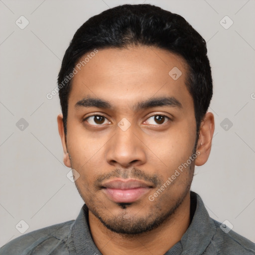 Neutral latino young-adult male with short  black hair and brown eyes