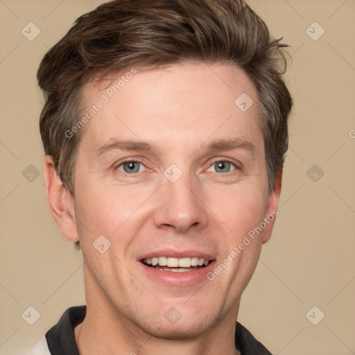 Joyful white adult male with short  brown hair and grey eyes