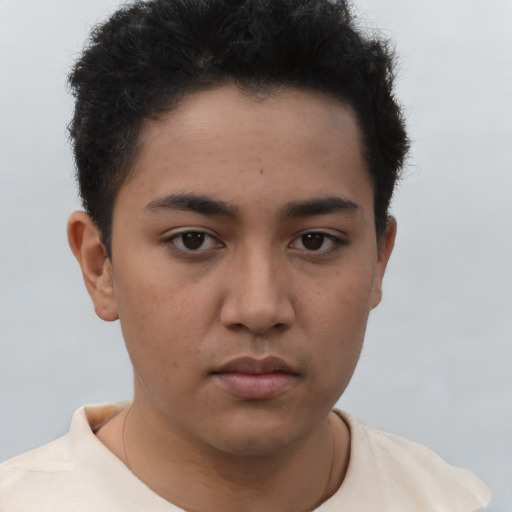 Neutral latino young-adult male with short  brown hair and brown eyes