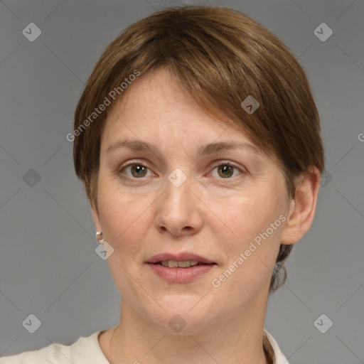 Joyful white adult female with short  brown hair and grey eyes