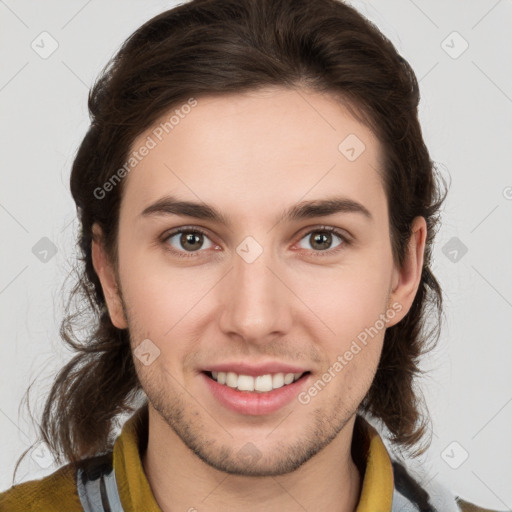 Joyful white young-adult male with medium  brown hair and brown eyes