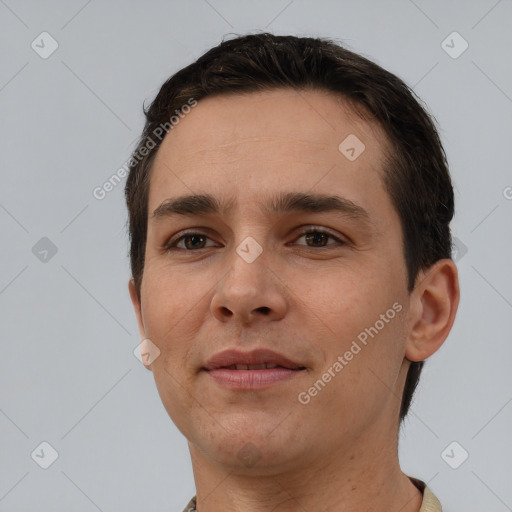 Joyful white young-adult male with short  brown hair and brown eyes