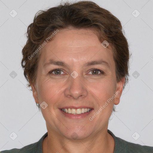 Joyful white adult female with short  brown hair and brown eyes