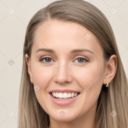 Joyful white young-adult female with long  brown hair and grey eyes