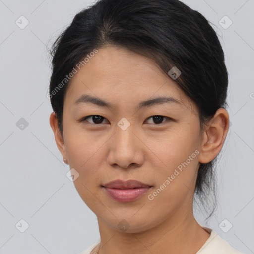 Joyful asian young-adult female with medium  brown hair and brown eyes