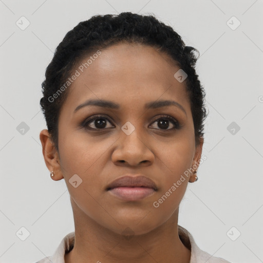 Joyful black young-adult female with short  black hair and brown eyes