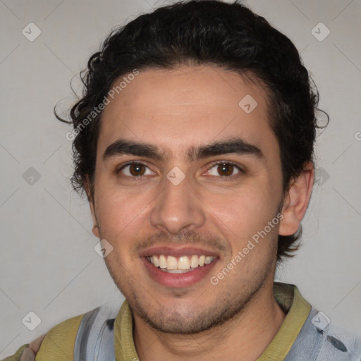 Joyful white young-adult male with short  black hair and brown eyes