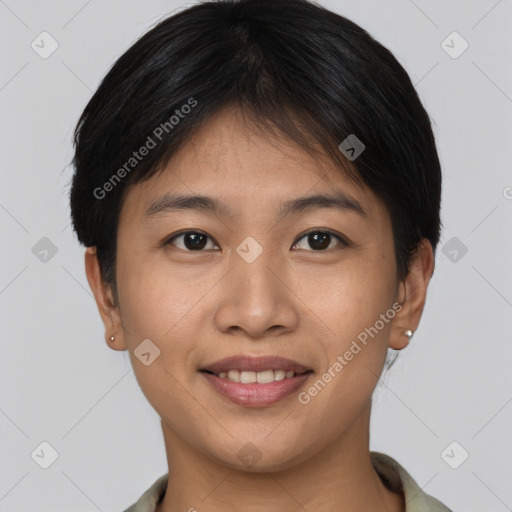 Joyful asian young-adult female with short  brown hair and brown eyes