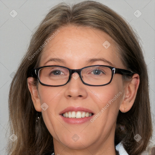 Joyful white adult female with long  brown hair and brown eyes