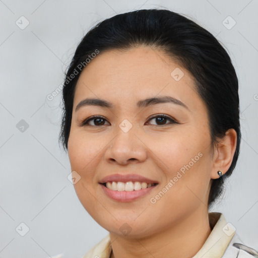 Joyful asian young-adult female with medium  brown hair and brown eyes