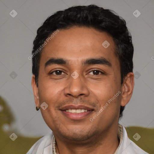 Joyful latino young-adult male with short  black hair and brown eyes