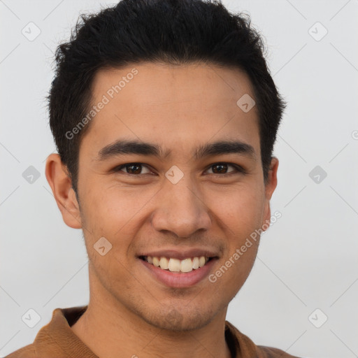 Joyful latino young-adult male with short  brown hair and brown eyes