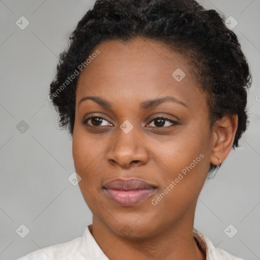 Joyful black adult female with short  brown hair and brown eyes