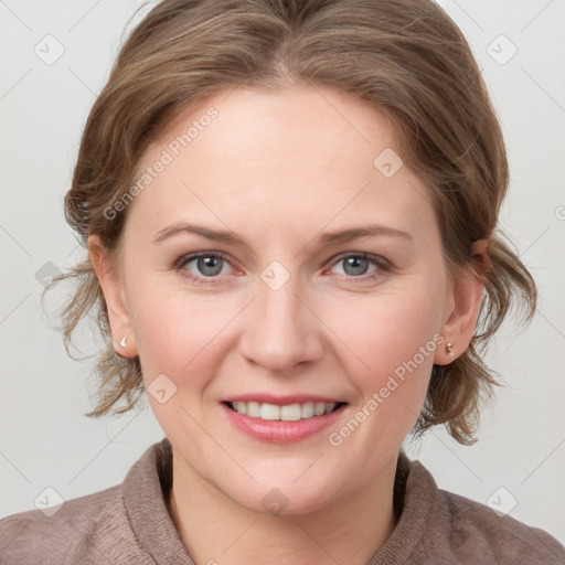 Joyful white young-adult female with medium  brown hair and blue eyes