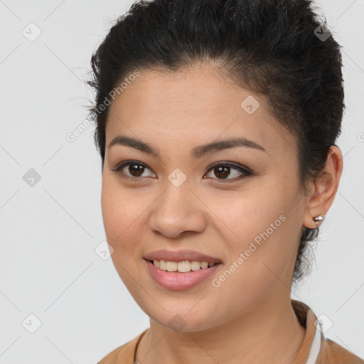 Joyful latino young-adult female with long  brown hair and brown eyes