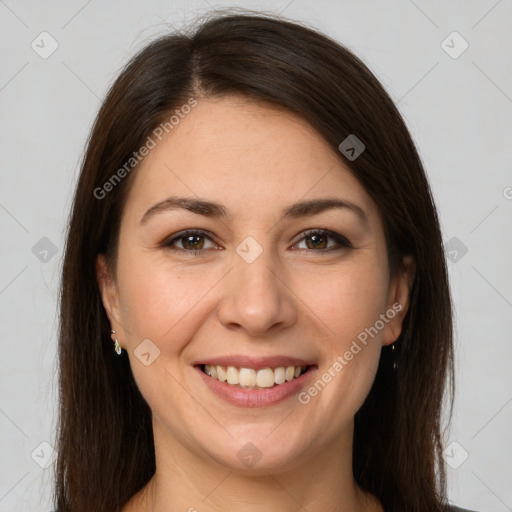 Joyful white young-adult female with long  brown hair and brown eyes