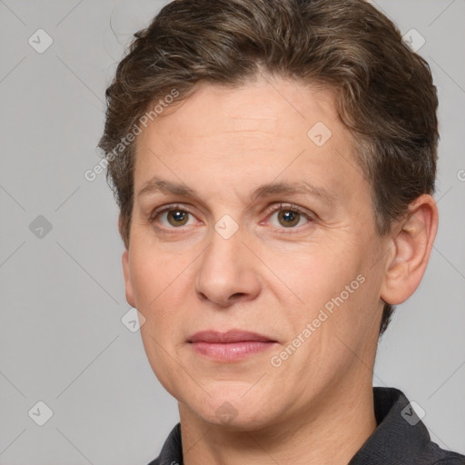 Joyful white adult female with short  brown hair and grey eyes