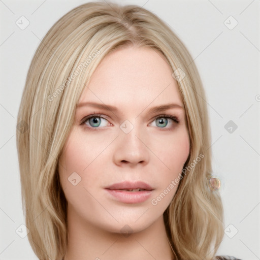 Neutral white young-adult female with long  blond hair and blue eyes