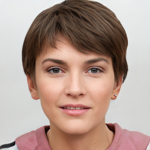 Joyful white young-adult female with short  brown hair and grey eyes