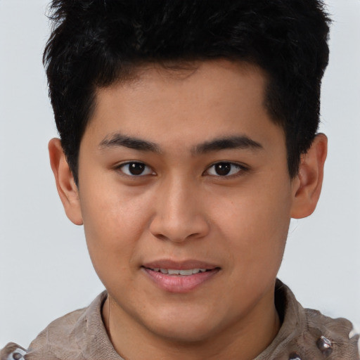 Joyful asian young-adult male with short  brown hair and brown eyes