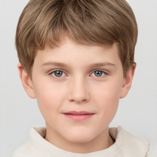 Joyful white child male with short  brown hair and grey eyes