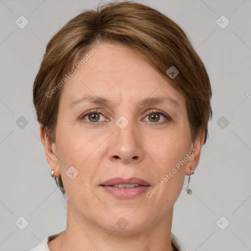 Joyful white adult female with short  brown hair and grey eyes