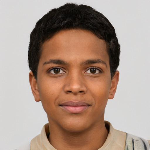 Joyful latino child male with short  brown hair and brown eyes
