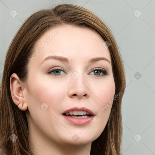 Joyful white young-adult female with long  brown hair and blue eyes