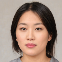 Neutral asian young-adult female with medium  brown hair and brown eyes