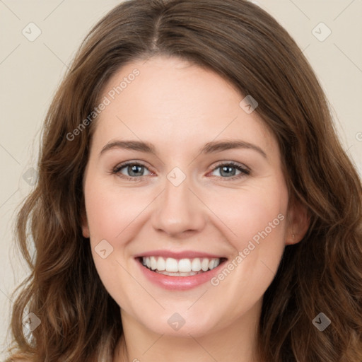 Joyful white young-adult female with long  brown hair and green eyes