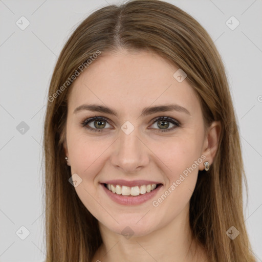 Joyful white young-adult female with long  brown hair and green eyes