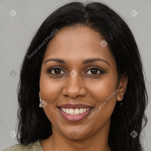 Joyful black young-adult female with long  brown hair and brown eyes