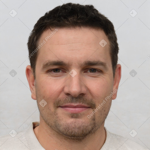 Joyful white adult male with short  brown hair and brown eyes