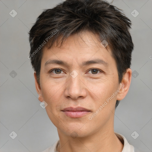 Joyful white adult male with short  brown hair and brown eyes